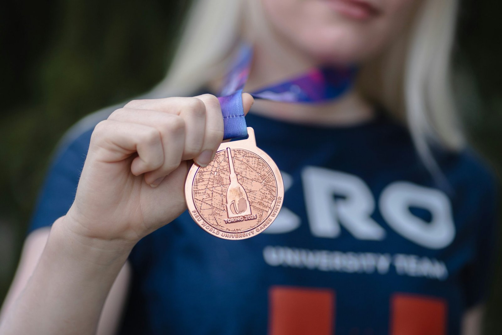 Athlete showing her winning medal